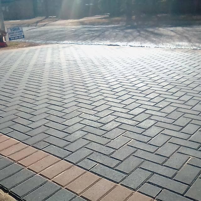 Completed herringbone brick paving driveway